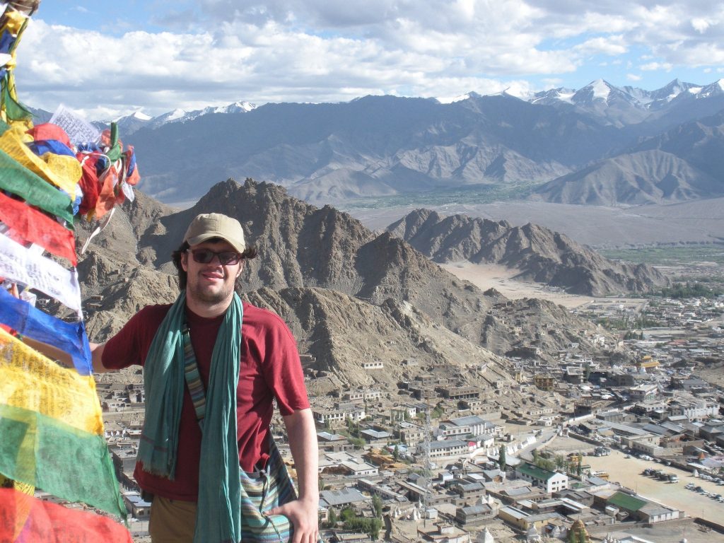 Damian Esteban standing in front of a great range of the Himalaya Mountains